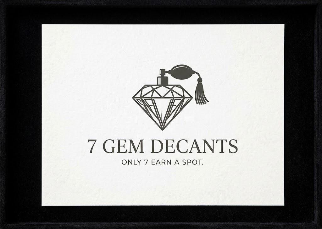 7 Gem Decants diamond perfume emblem on textured ivory paper and black fabric